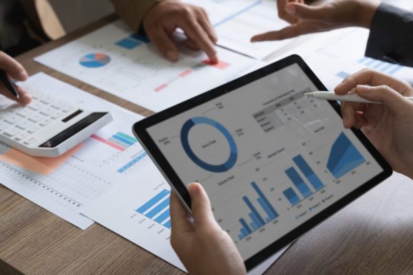 business adviser meeting to analyze and discuss the situation on the financial report in the meeting room.Investment Consultant, Financial advisor and accounting concept.